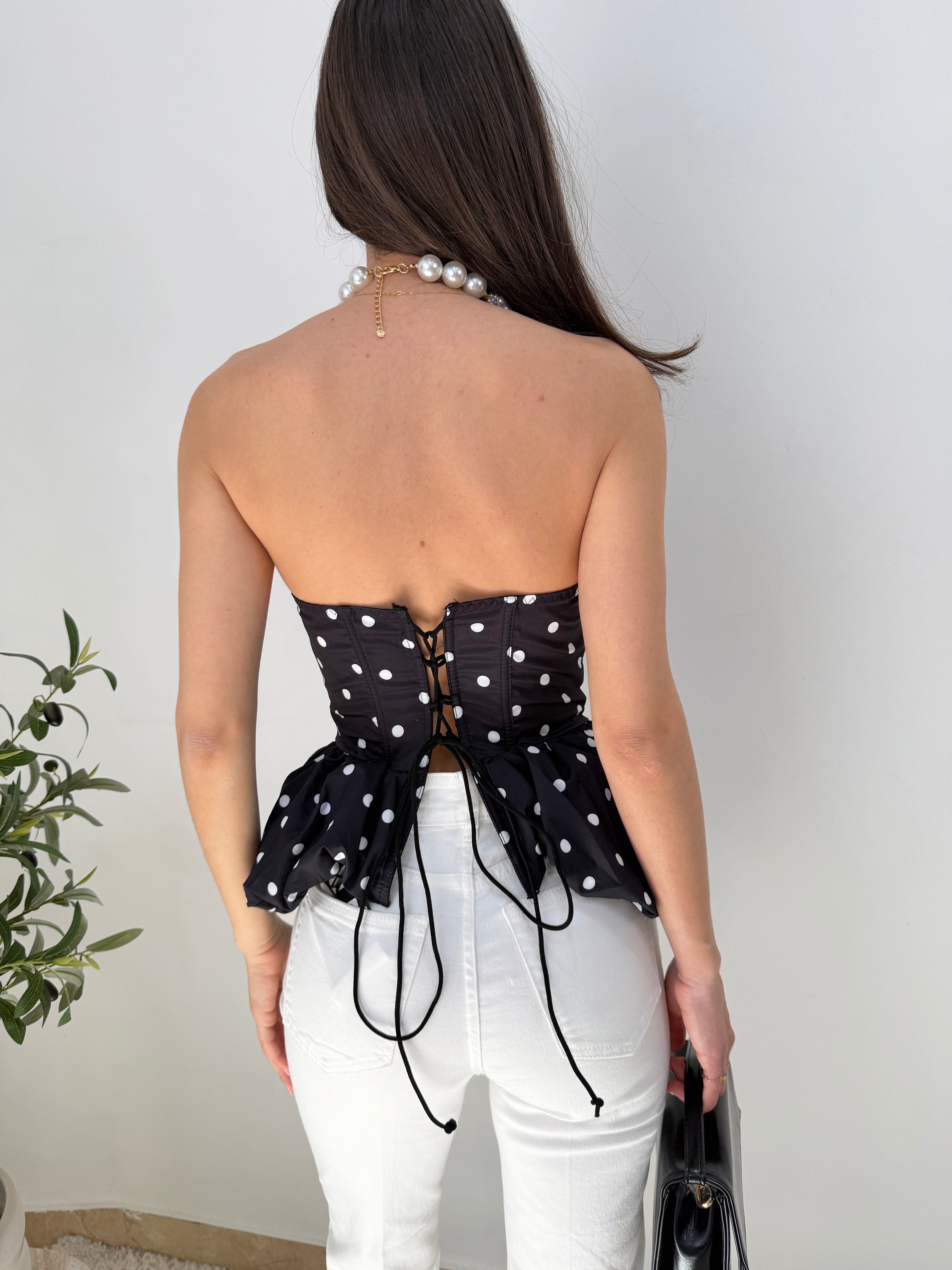 Top bustier a pois con balza