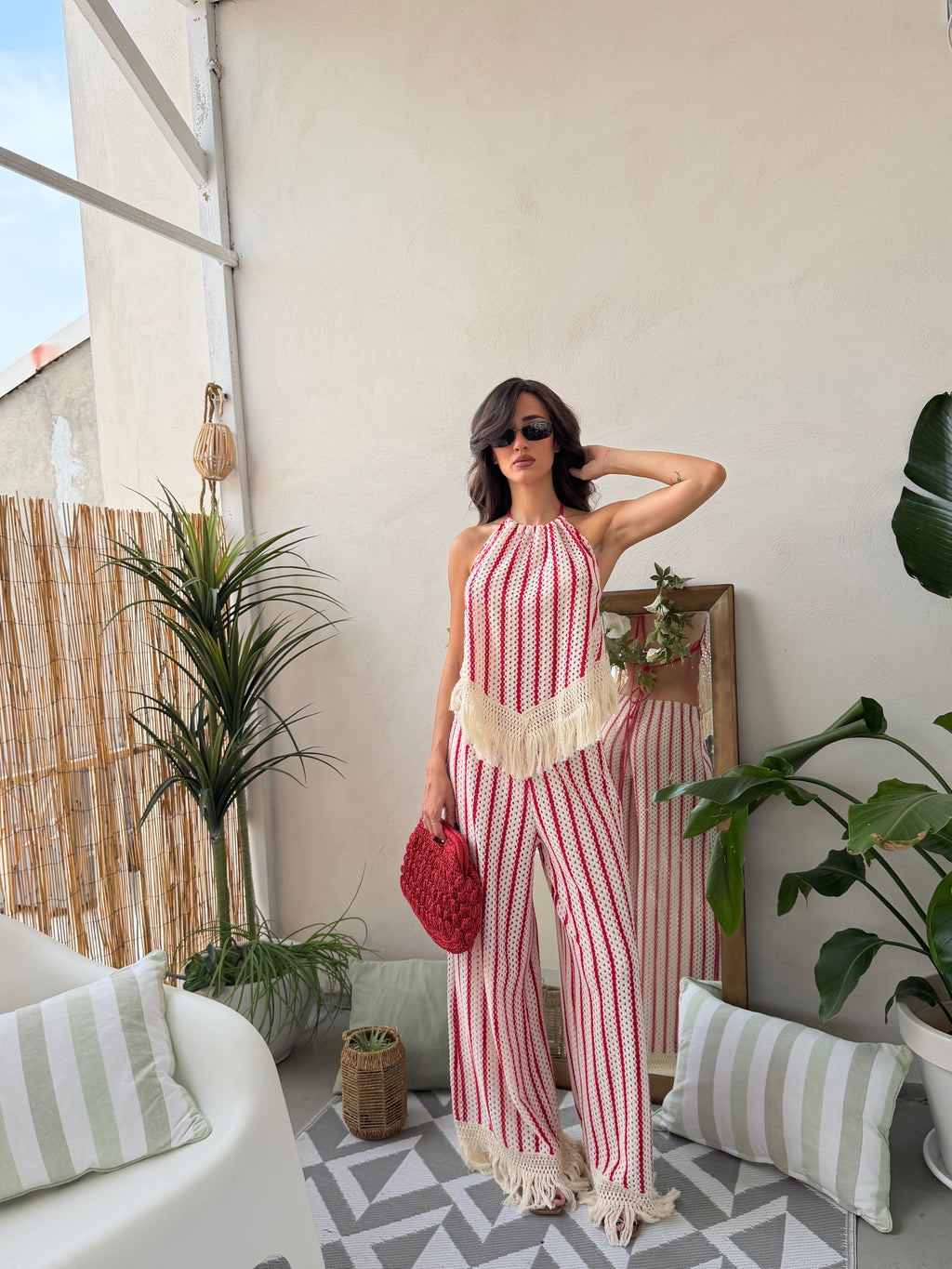 Coordinato in maglia traforata con top a e pantalone palazzo con frange