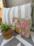 Pochette intrecciata con applicazioni decorative