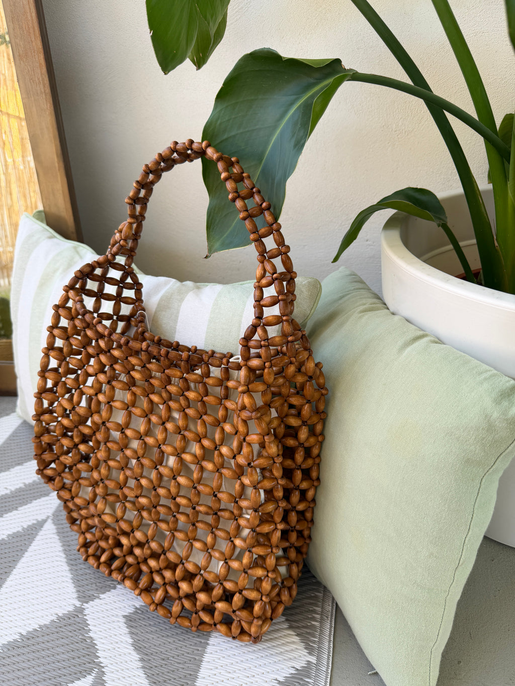 Borsa con perline effetto intrecciato