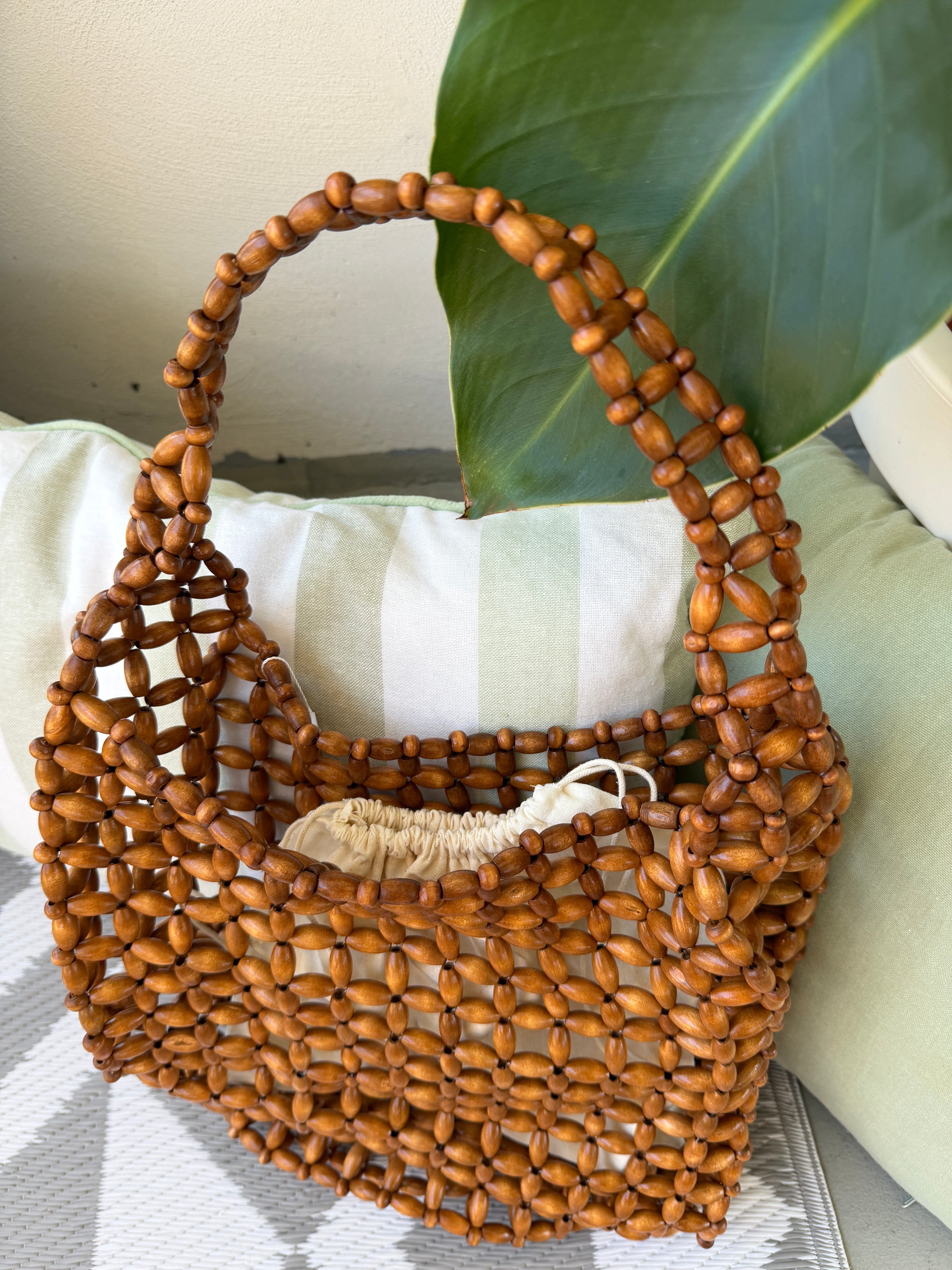Borsa con perline effetto intrecciato