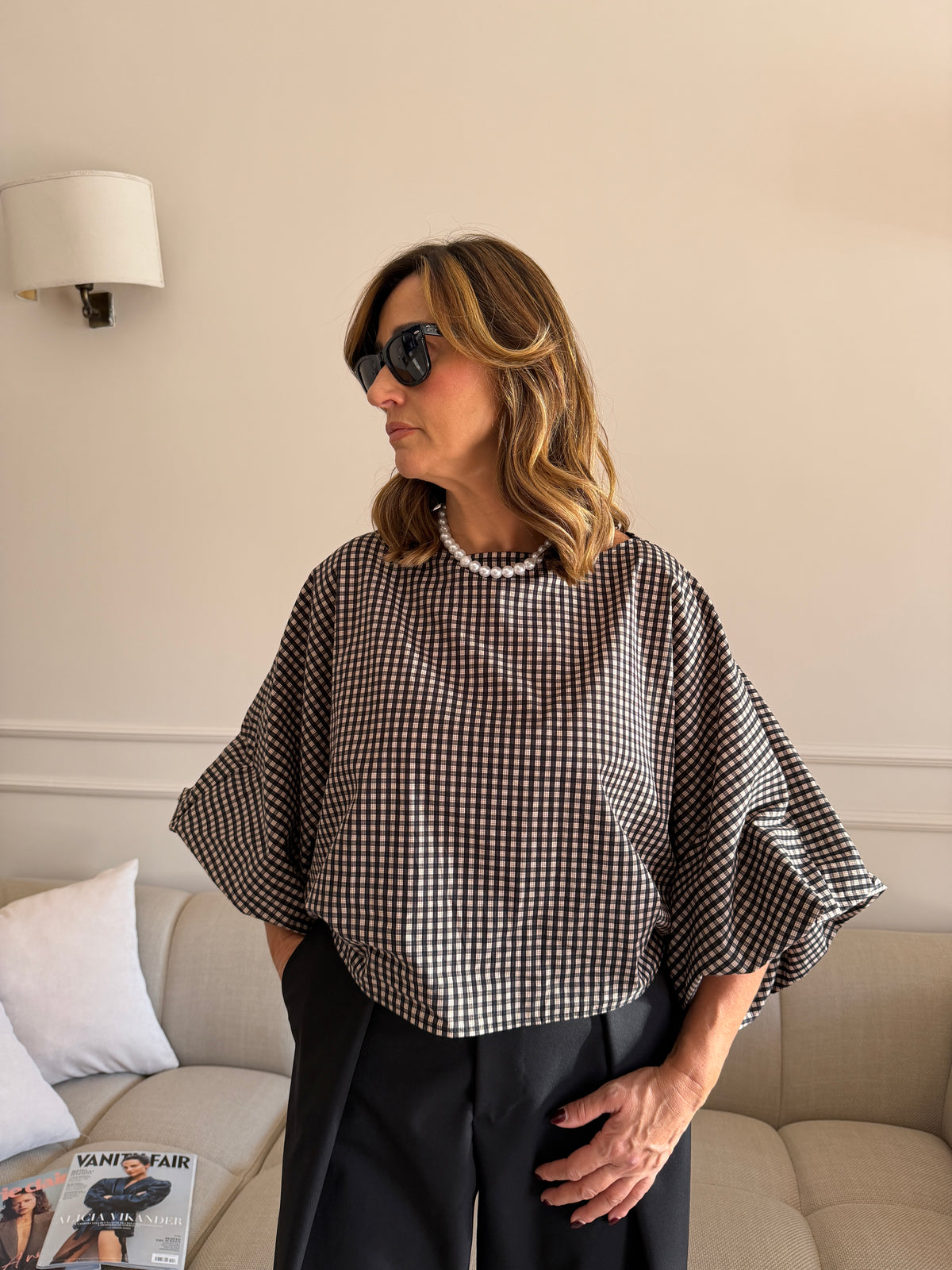 Blusa a quadri con maniche ampie