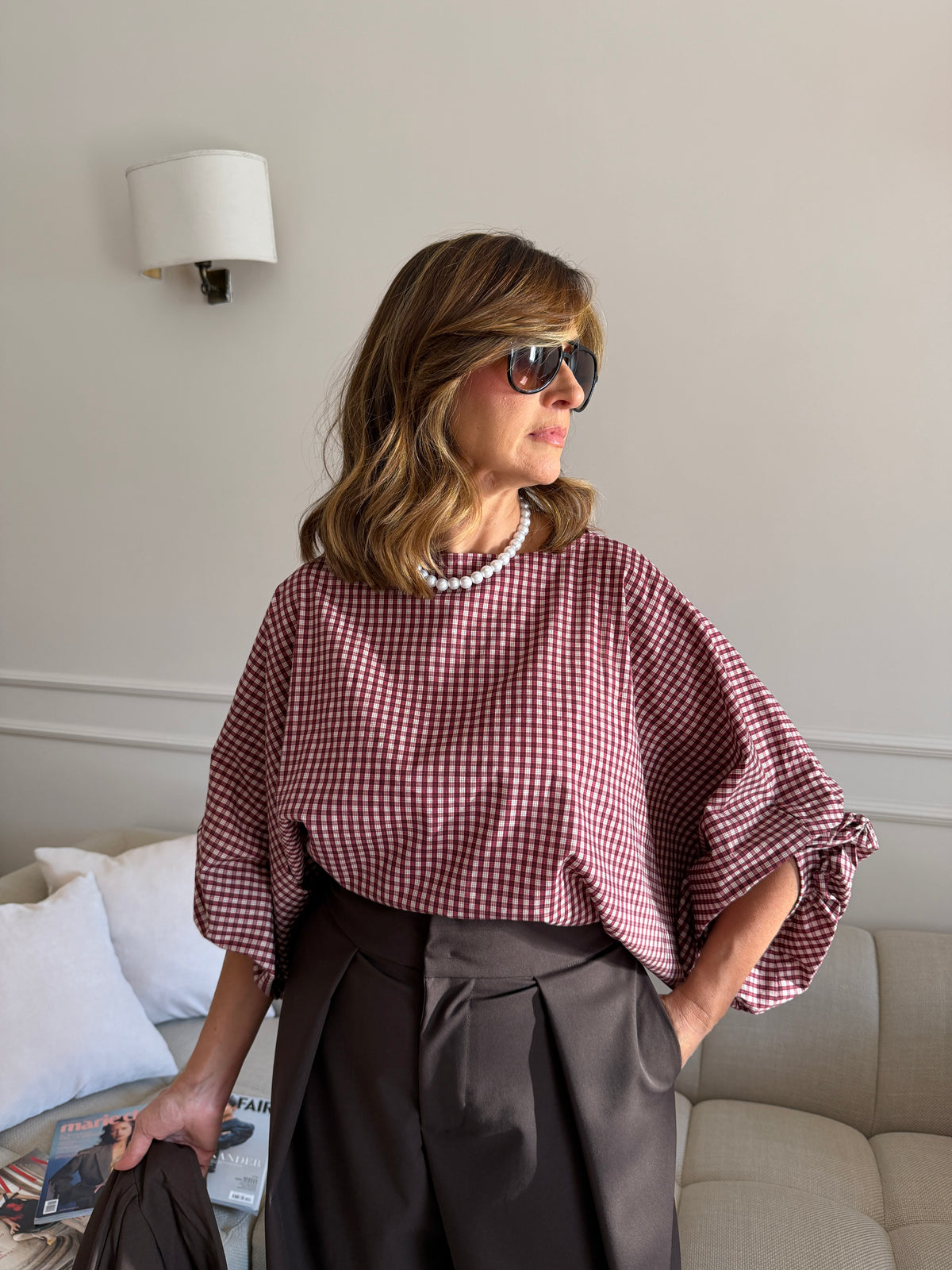 Blusa a quadri con maniche ampie