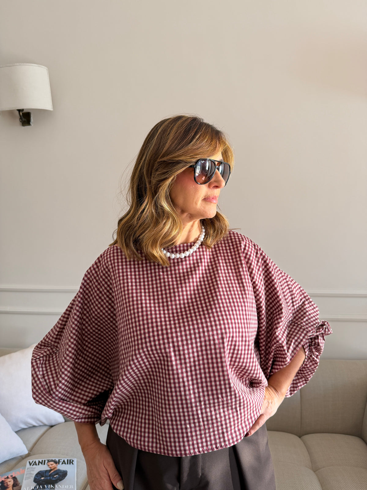 Blusa a quadri con maniche ampie