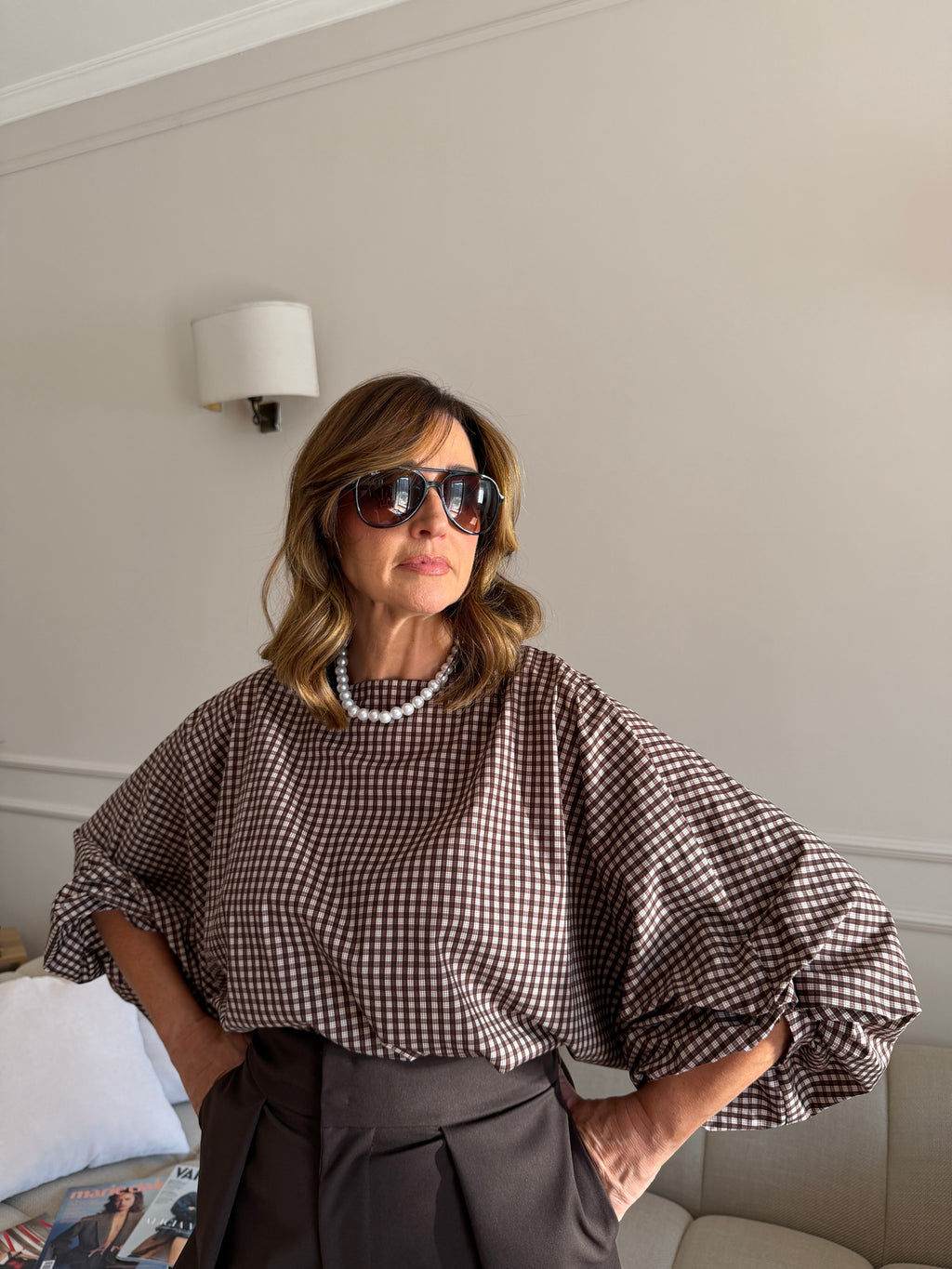 Blusa a quadri con maniche ampie
