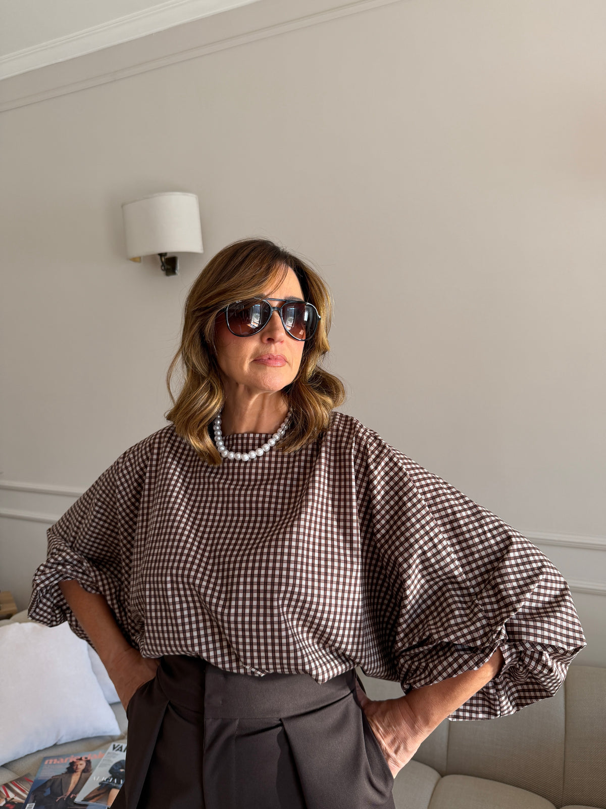 Blusa a quadri con maniche ampie