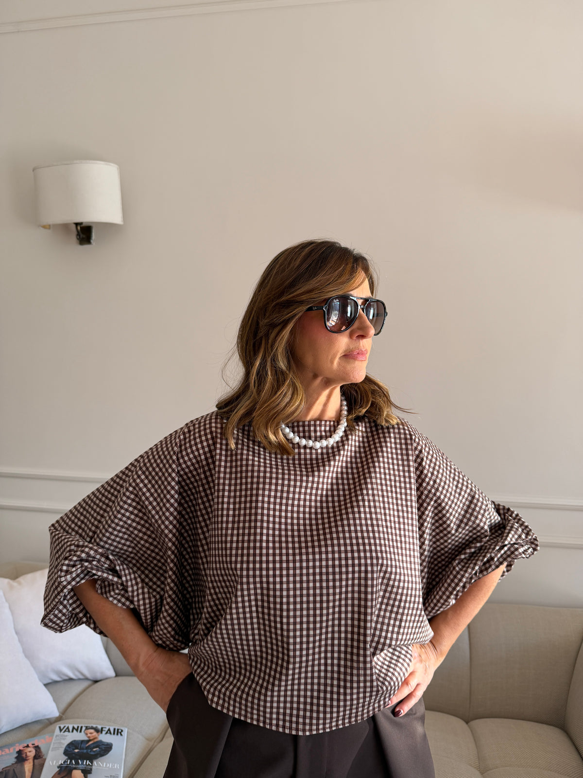 Blusa a quadri con maniche ampie